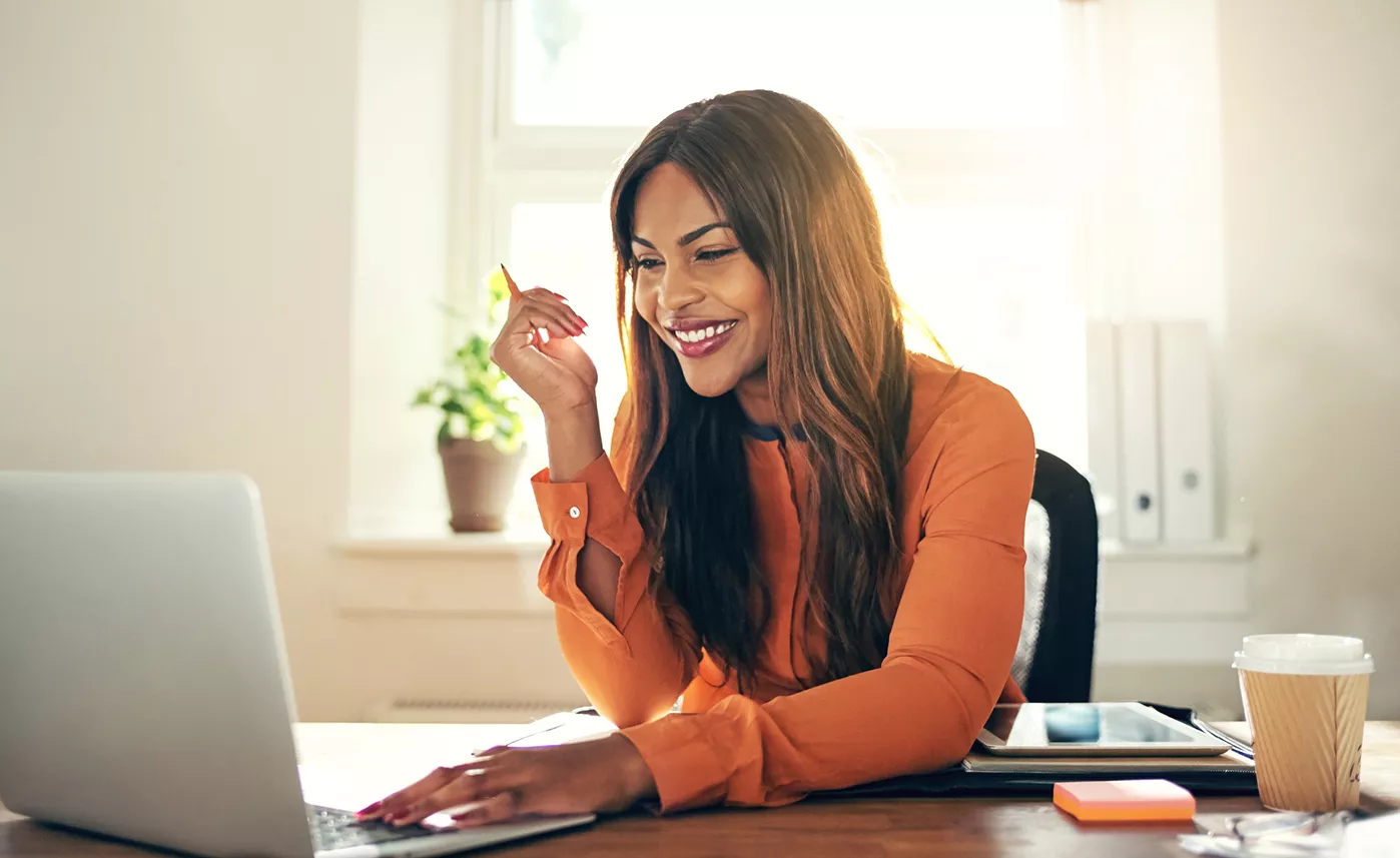 Woman looking at laptop.