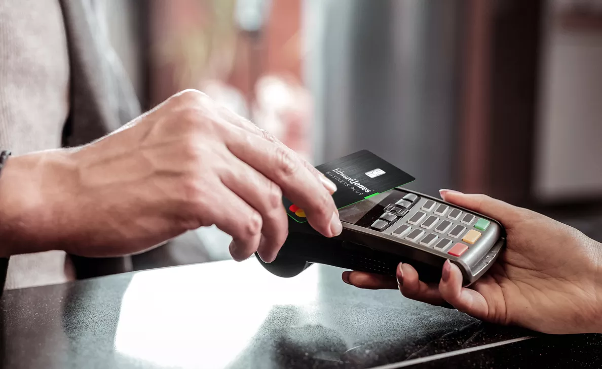  A customer pays a business owner with a credit card.
