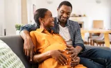 Couple feeling the baby